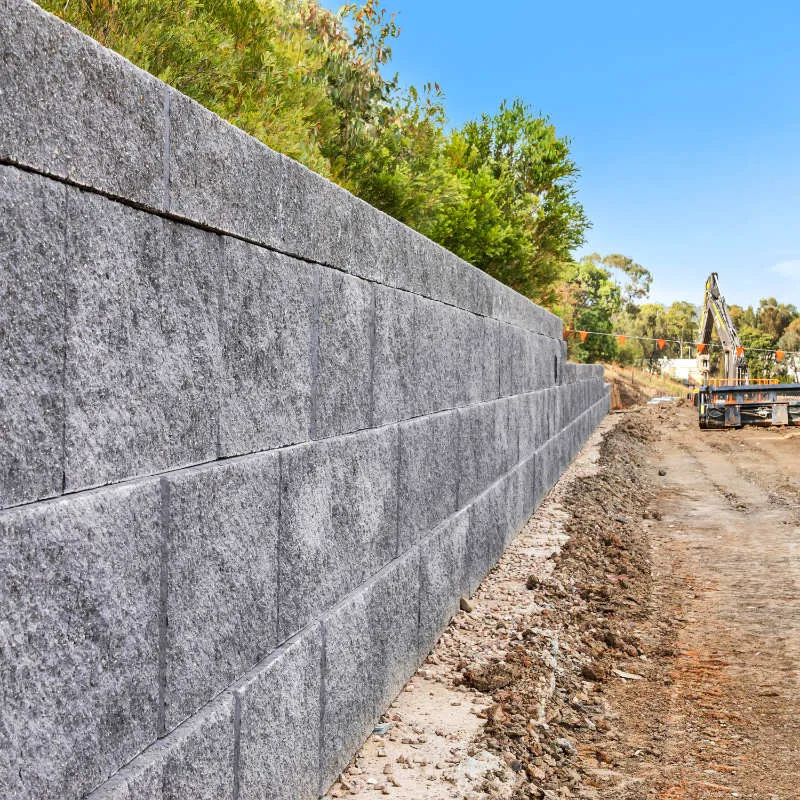 Keymass precast block placed by a UCBC excavator with a block grab