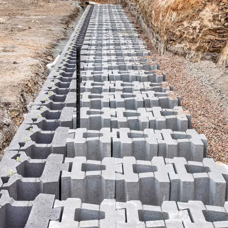 Keymass precast block placed by a UCBC excavator with a block grab