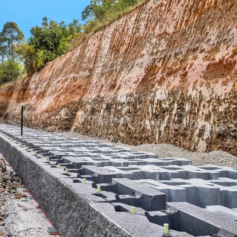 Keymass precast block placed by a UCBC excavator with a block grab