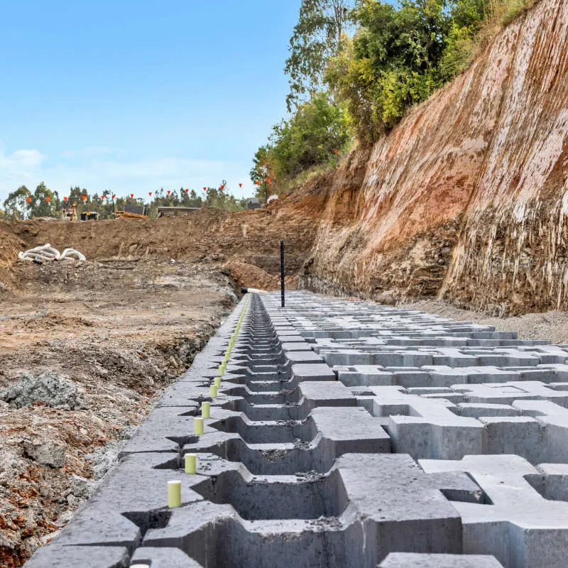 Keymass precast block placed by a UCBC excavator with a block grab