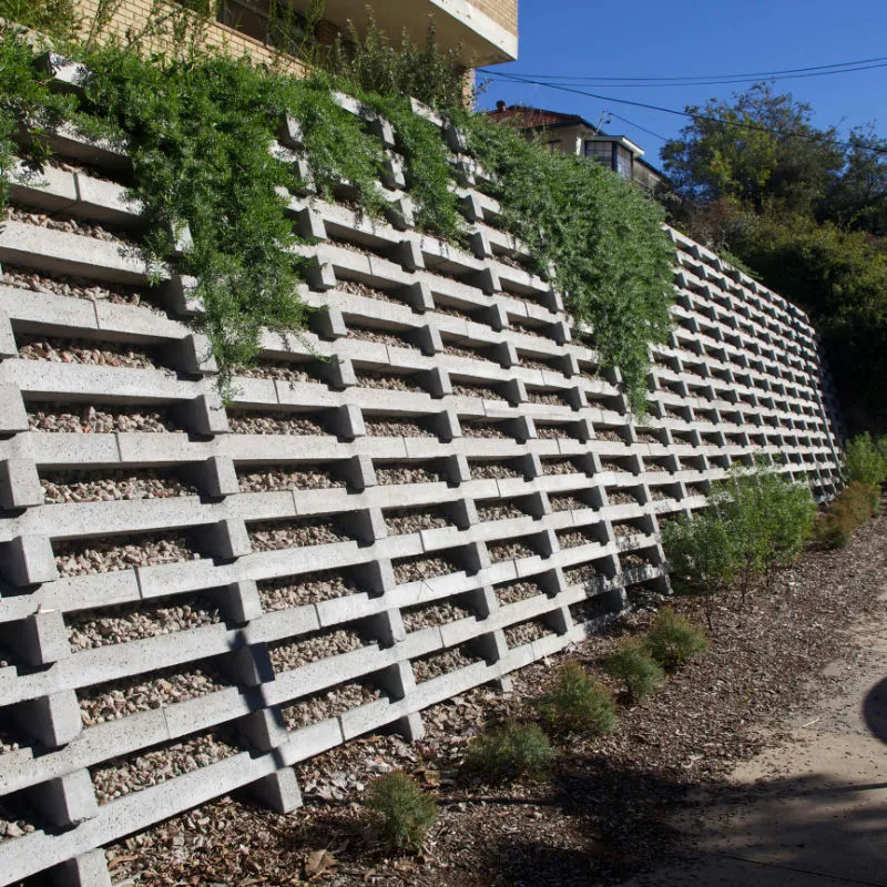 Concrete crib block retaining wall with planted face